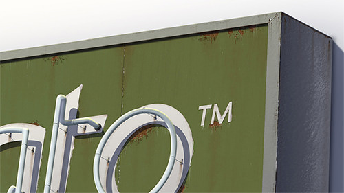 Worn-out sign with dented metal frame.